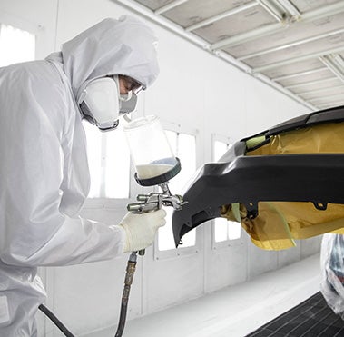 Collision Center Technician Painting a Vehicle | Jeff Hunter Toyota in Waco TX